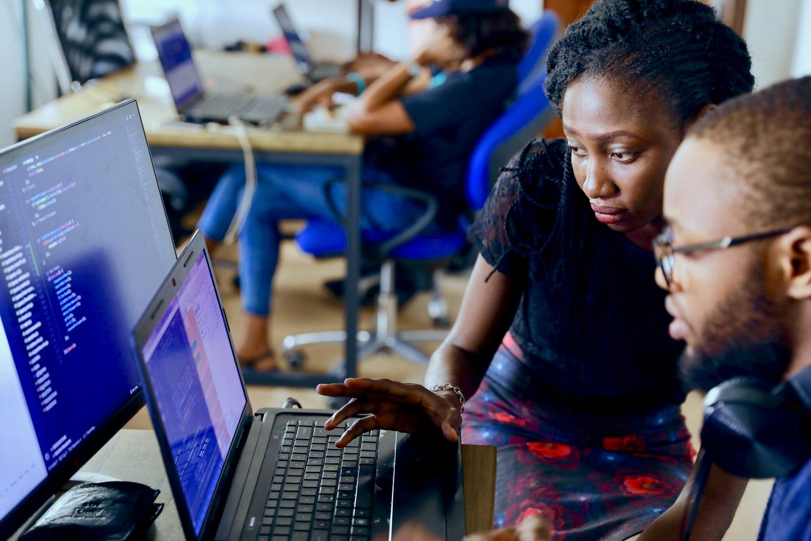 Two founders working together on a laptop